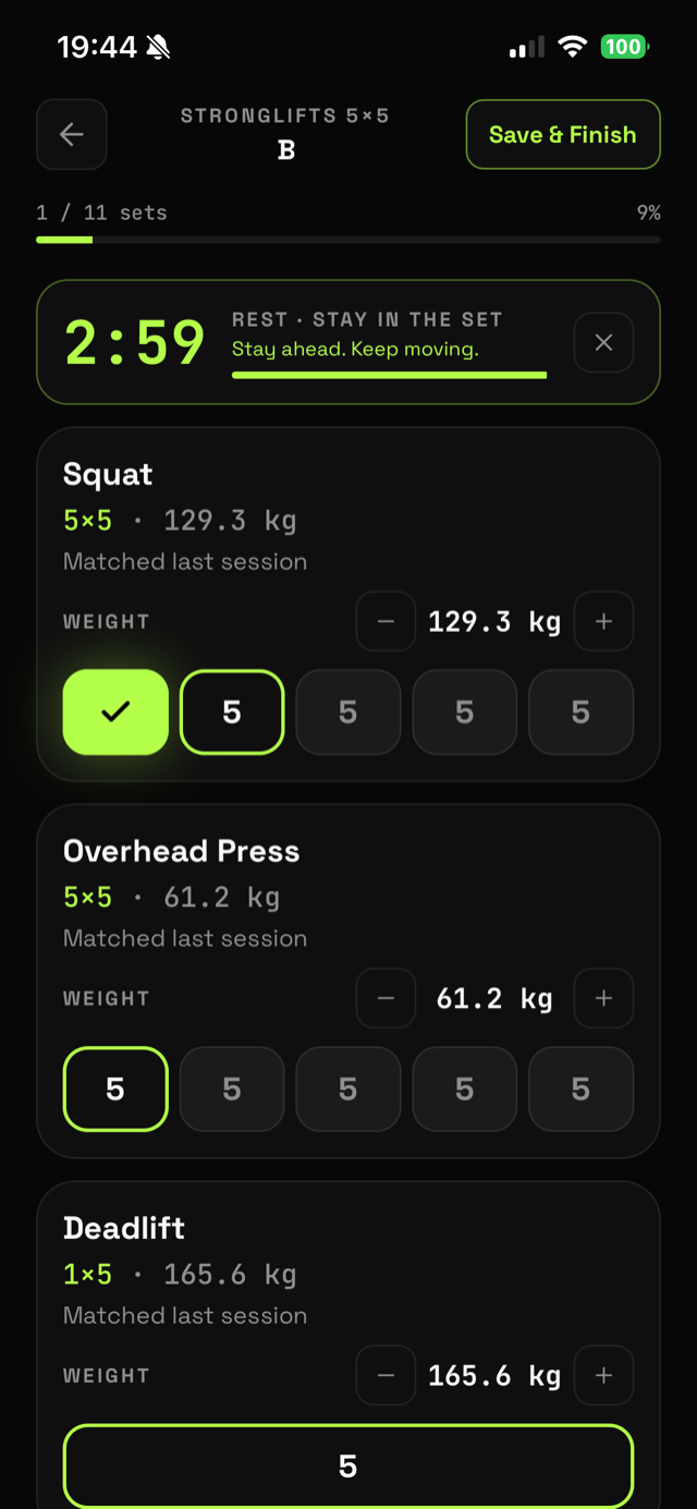The RIVL workout logger mid-session: Squat 5x5 at 129.3 kg with the first set logged and a rest timer counting down from 2:59.